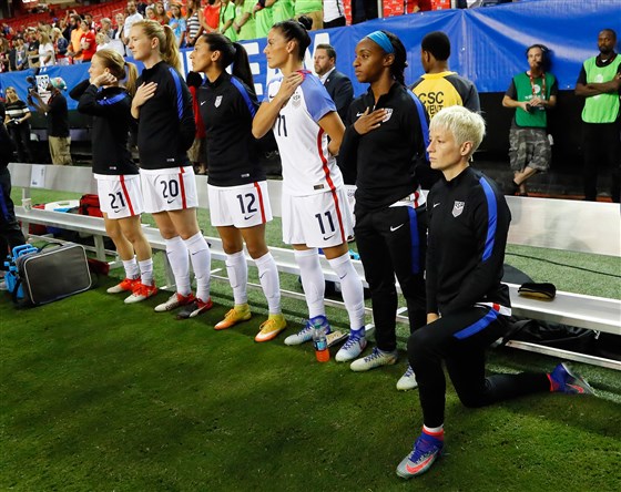 Megan Rapinoe kneels.jpg
