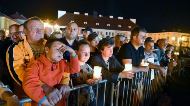 People held candles to mark the occasion at the ceremony in Wielun.jpg